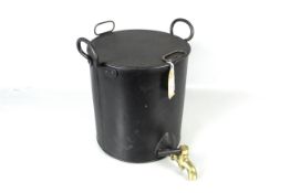 A large boiling pot with twin handles, lid and a brass tap