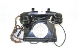 A vintage rotary dial telephone