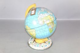 A small tin plate world globe