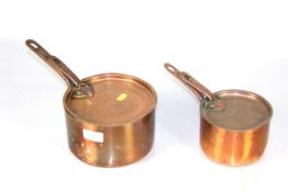 Two copper saucepans with lids