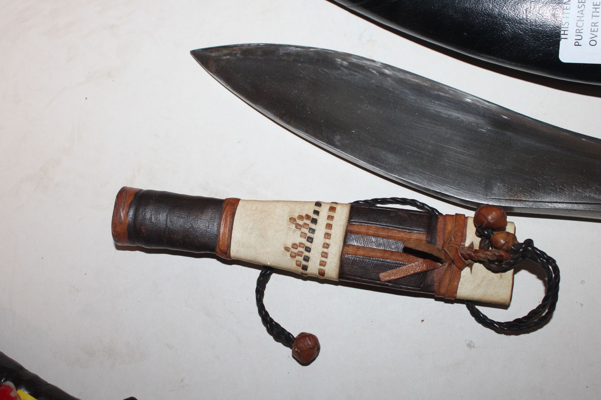 A Kukri knife together with a leather handled dagg - Image 5 of 13