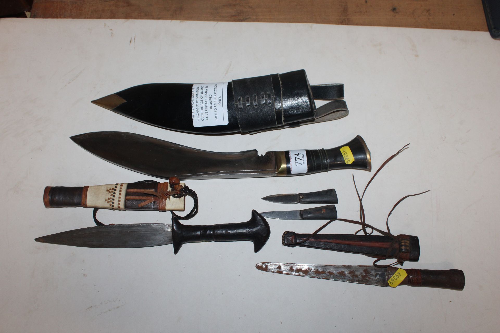 A Kukri knife together with a leather handled dagg