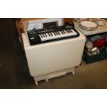 A painted gate leg table having integral storage