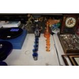 Two coloured glass liquor sets