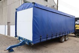 A S Marston B1010 25ft twin axle flatbed trailer. 2010. Fitted with curtain side body. With oil
