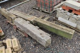 2x wooden gate posts.