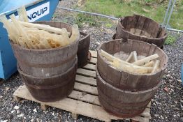 Various half oak barrels with a quantity of tree g