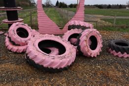 Quantity of tractor tyres, used as props.