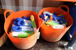 2x trugs containing a large quantity of water pist