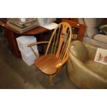 A light Ercol armchair