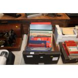 A box containing 10 stamp albums and contents