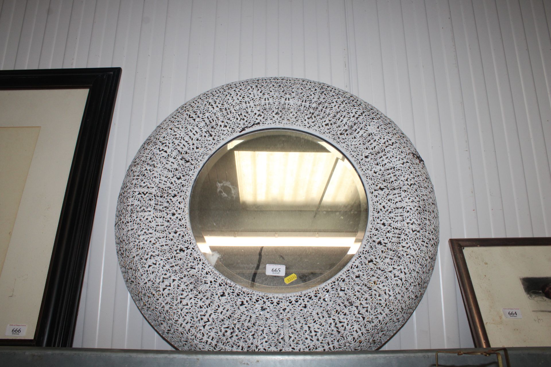 A Libra wirework framed and bevel edged circular w