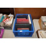 A box containing 13 stamp albums and contents