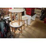 Three wooden based circular occasional tables, a d