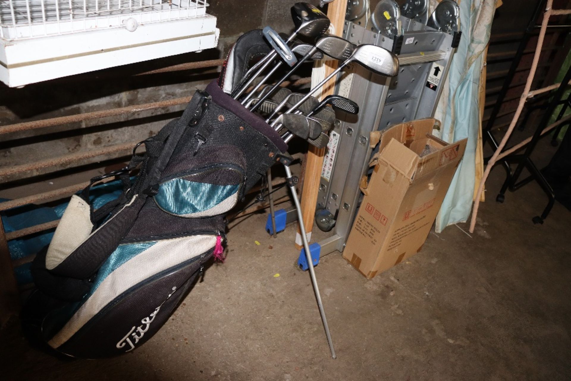 A Titleist golf bag with contents to include an Od