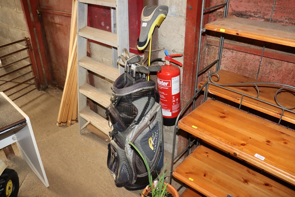 A Powercaddy golf bag and a collection of various