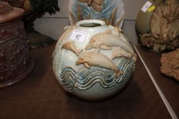 A pottery vase signed F. R. with Bernard Rooke label to base decorated with dolphins