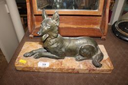 An Art Deco French spelter dog raised on marble pl