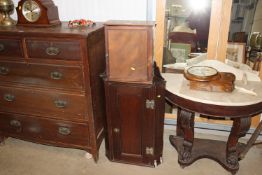 An oak corner cabinet and a wall mounting storage