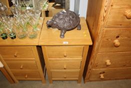 A modern John Lewis oak effect bedside chest fitte
