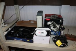 An Xbox 360, a Sega Megadrive, a Logitech cordles