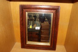 An inlaid framed wall mirror