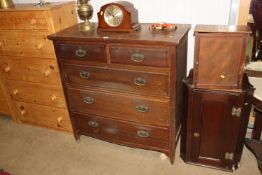 An oak chest fitted two short over three long draw