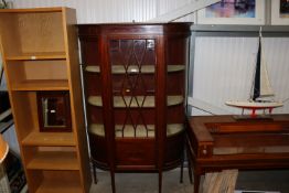 An Edwardian mahogany and chequer band bow fronted