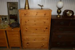 A stripped pine chest fitted five long drawers AF