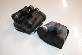 A pair of Precisa Luxus binoculars and a pair of B