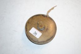 A brass cased lawn tennis measure by T.H. Ayres, m