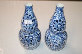 A pair of blue and white porcelain double gourd sh