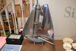 A 1930's electric fire on the form of a yacht with
