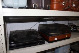 A Kenwood stereo turntable together with one other