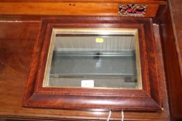 An inlaid framed wall mirror