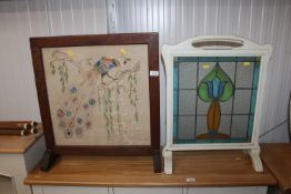 An oak framed firescreen together with a stained