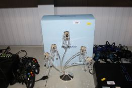 A Wedgwood silver plated candelabra hung with glas