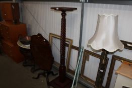 A mahogany torchere stand