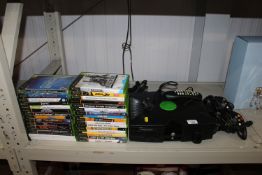 An Xbox together with a quantity of various Xbox g