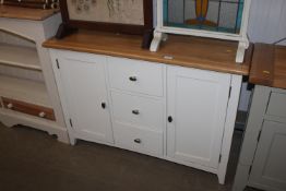 A modern oak topped sideboard fitted three centra