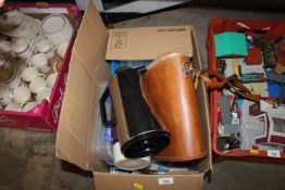 A box containing various Thermoses, storage boxes