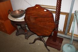 A mahogany tilt top side table