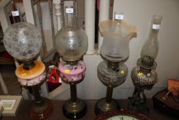 An Evered & Co. twin burner oil lamp with brass co