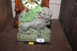A Victorian cast iron doorstop in the form of a li