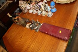 A cased carving set, two plated rabbit egg stands, duck ornament etc.  This item can only be