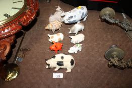 A collection of various pottery pigs to include Rye Pottery, West German, Plichta etc.