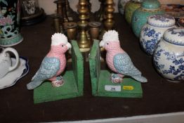 A pair of cast iron budgerigar bookends
