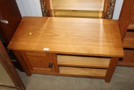 A modern light oak TV stand