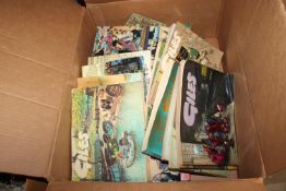 A box containing various Giles annuals
