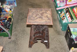 A carved oak stool AF